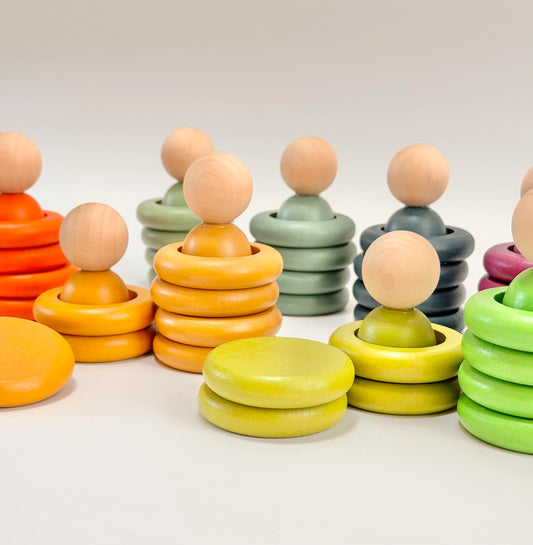 Colorful wooden stacking rings on a white background