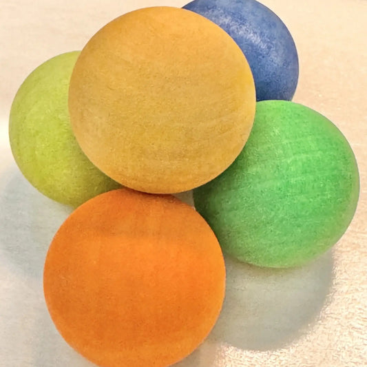 Set of five large colorful wooden marbles, perfect for safe and imaginative play for children.