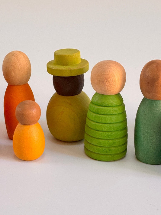 Colorful wooden peg dolls set featuring various shapes and sizes, designed for imaginative play and diversity.