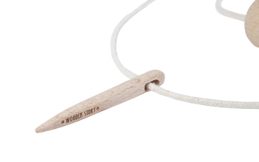 Wooden Needle XL for threading blocks on soft cotton string, enhancing fine motor skills for children.