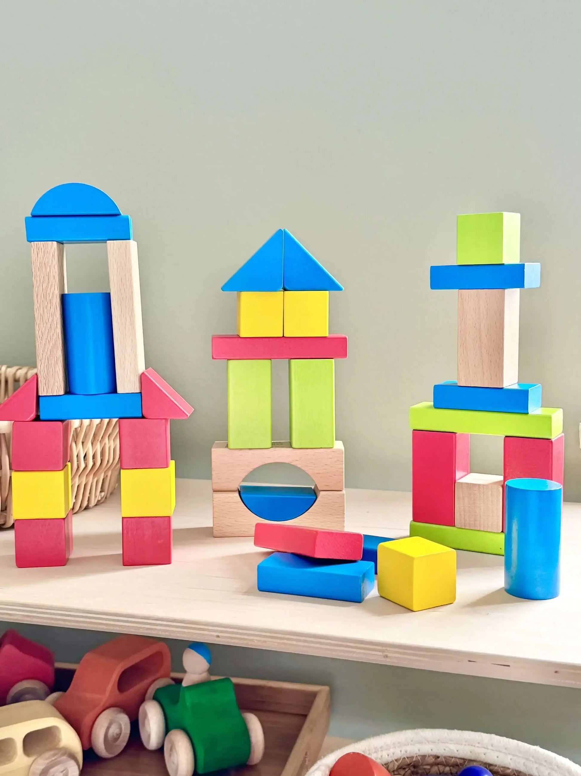 Brightly colored wooden building blocks set for toddlers, Montessori inspired eco-friendly toy for open-ended play and fine motor skills development in children.