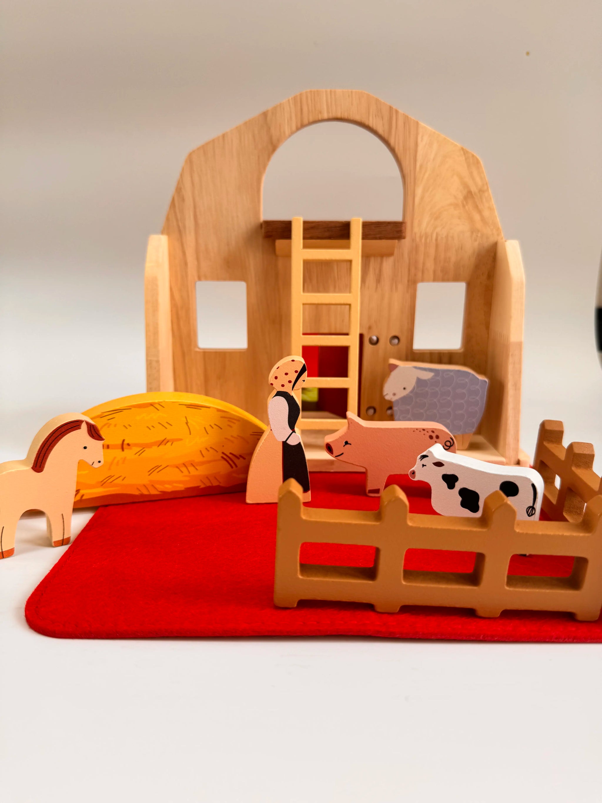 Folding Wooden Farmyard House with animals, accessories, and a farmer figure for imaginative play.