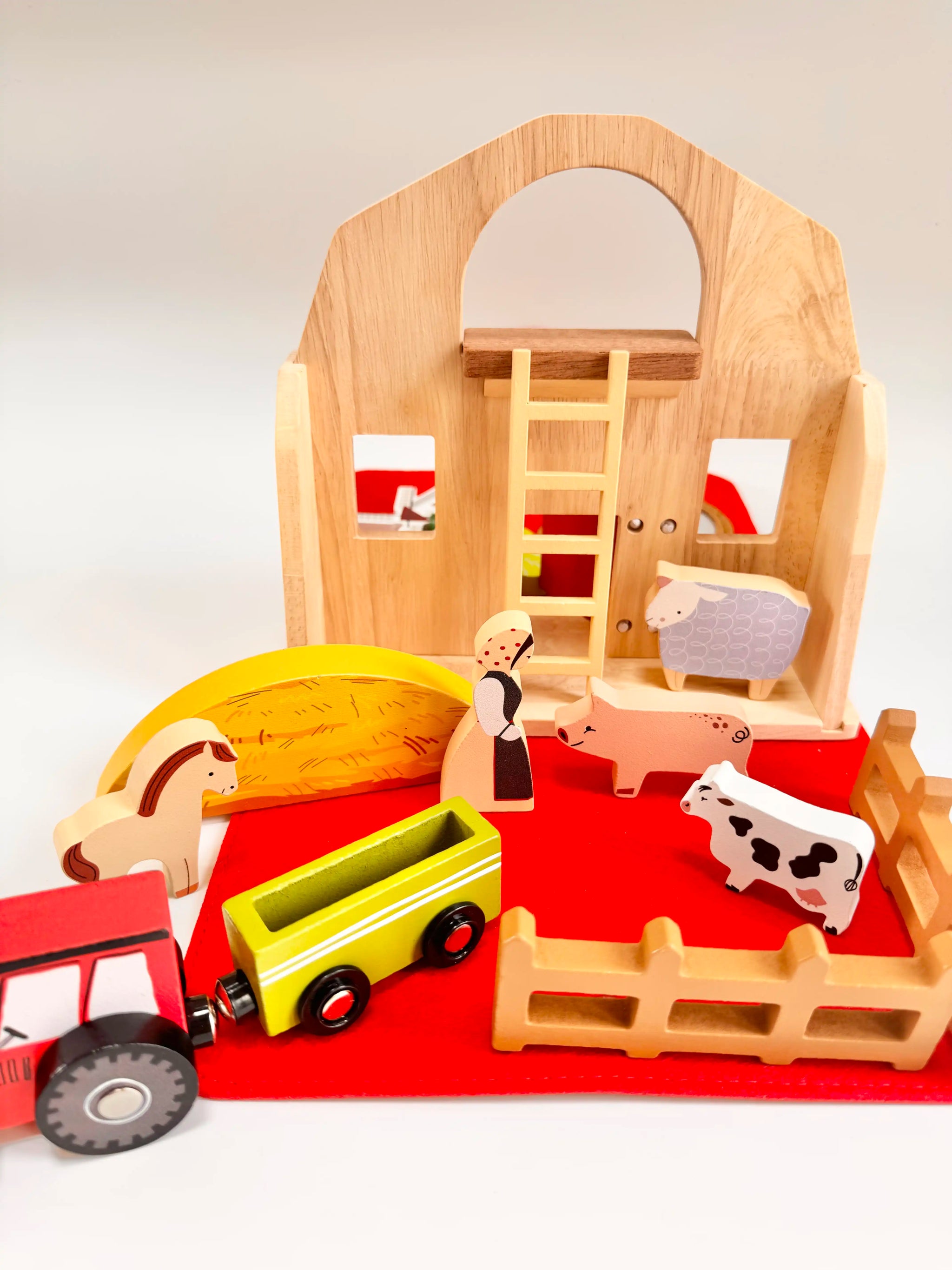 Folding Wooden Farmyard House toy set with animals and tractor, perfect for imaginative play for toddlers.
