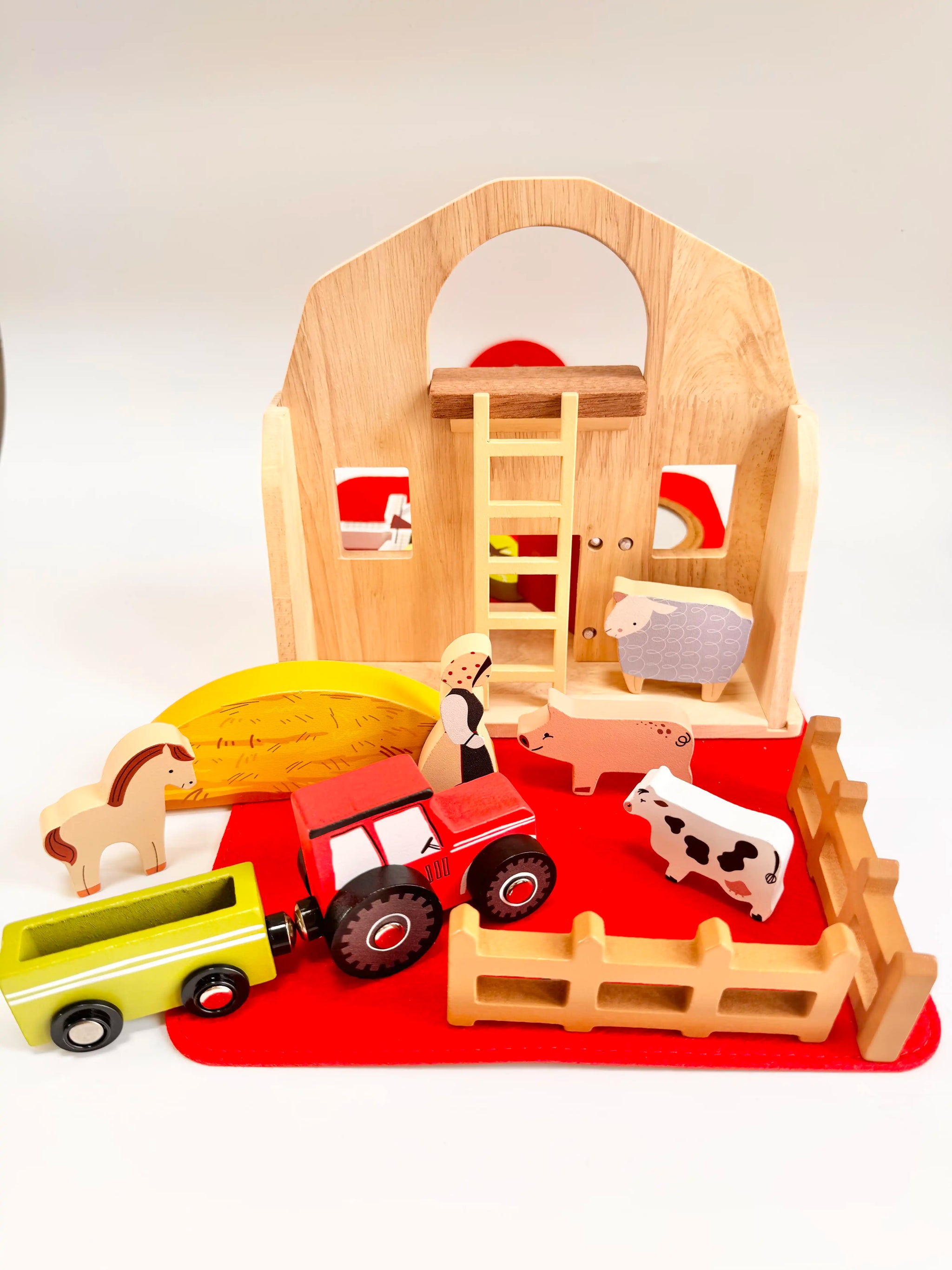 Folding Wooden Farmyard House with tractor, animals, and accessories for imaginative play.