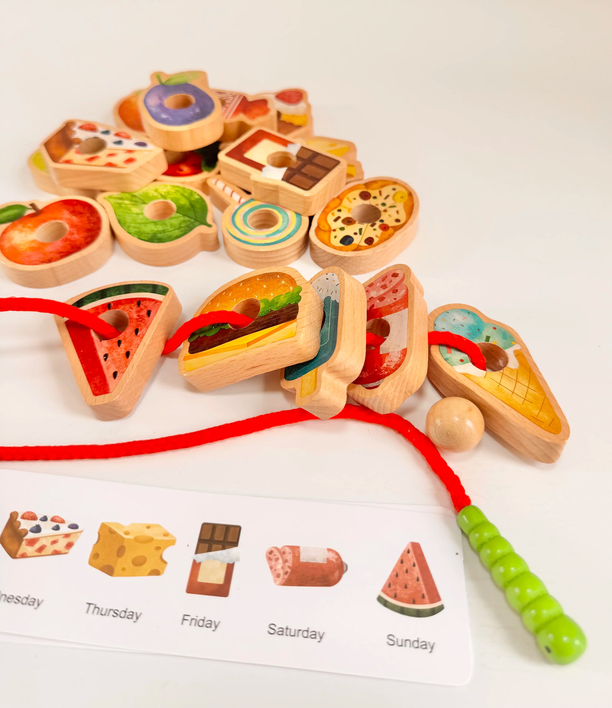 Caterpillar Threading Set with colorful wooden food pieces and themed menu cards for imaginative play and learning.