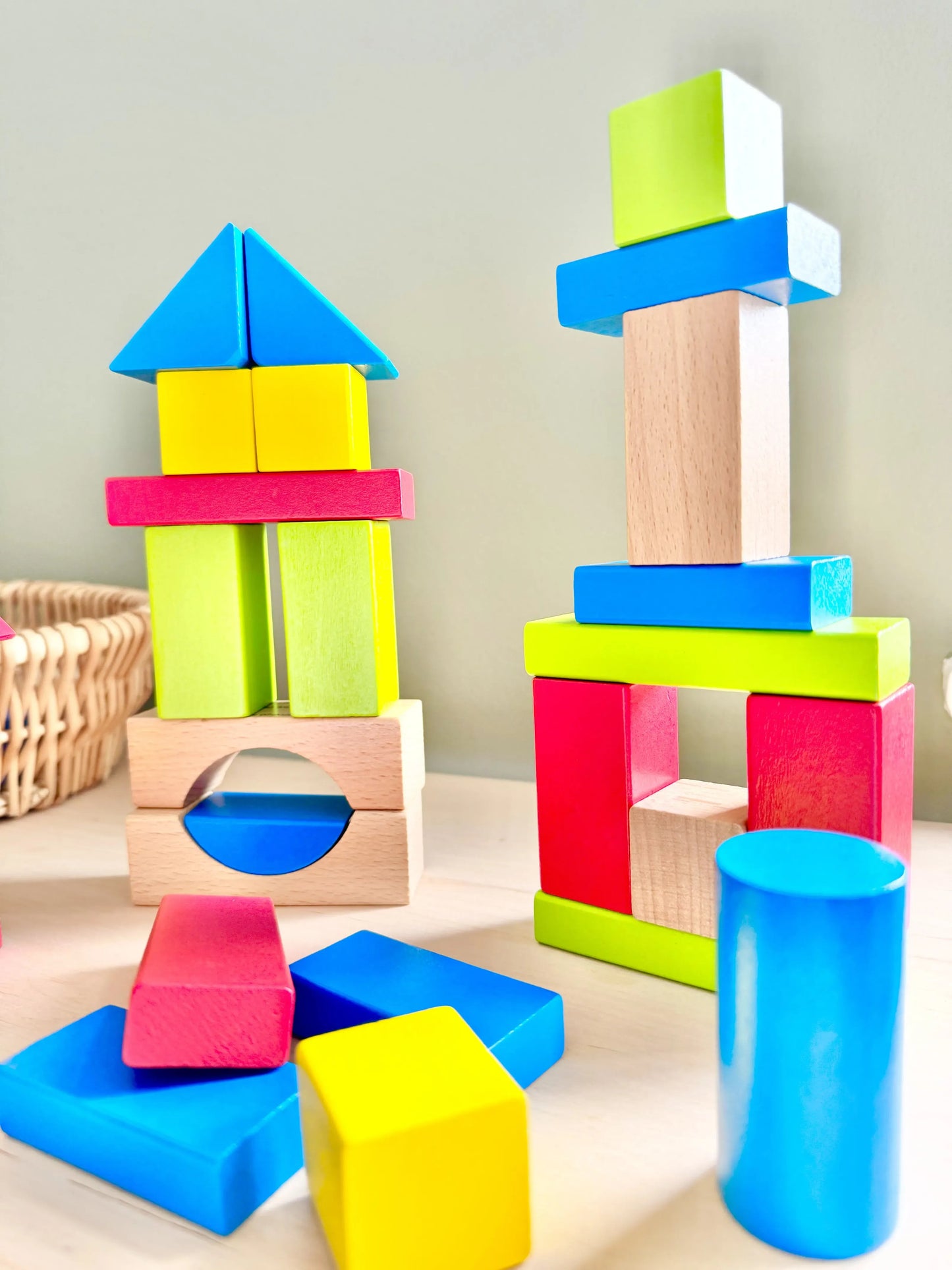 Brightly coloured wooden Montessori building blocks for toddlers, perfect for open-ended play, made from eco-friendly maple wood.