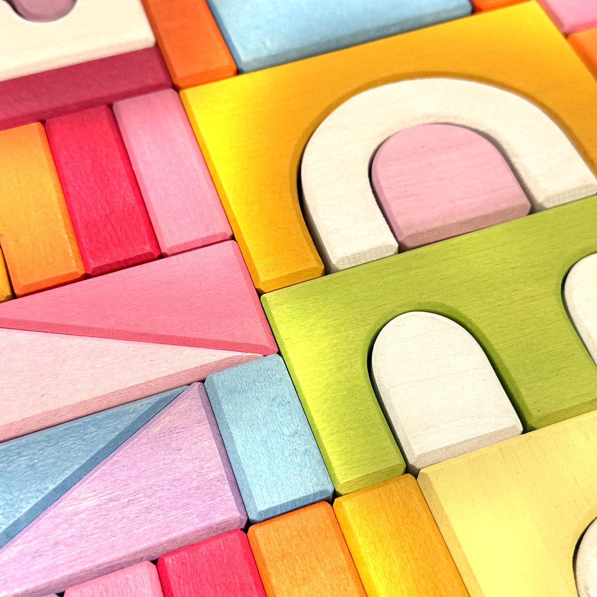 Close-up of colourful wooden castle building blocks and arches