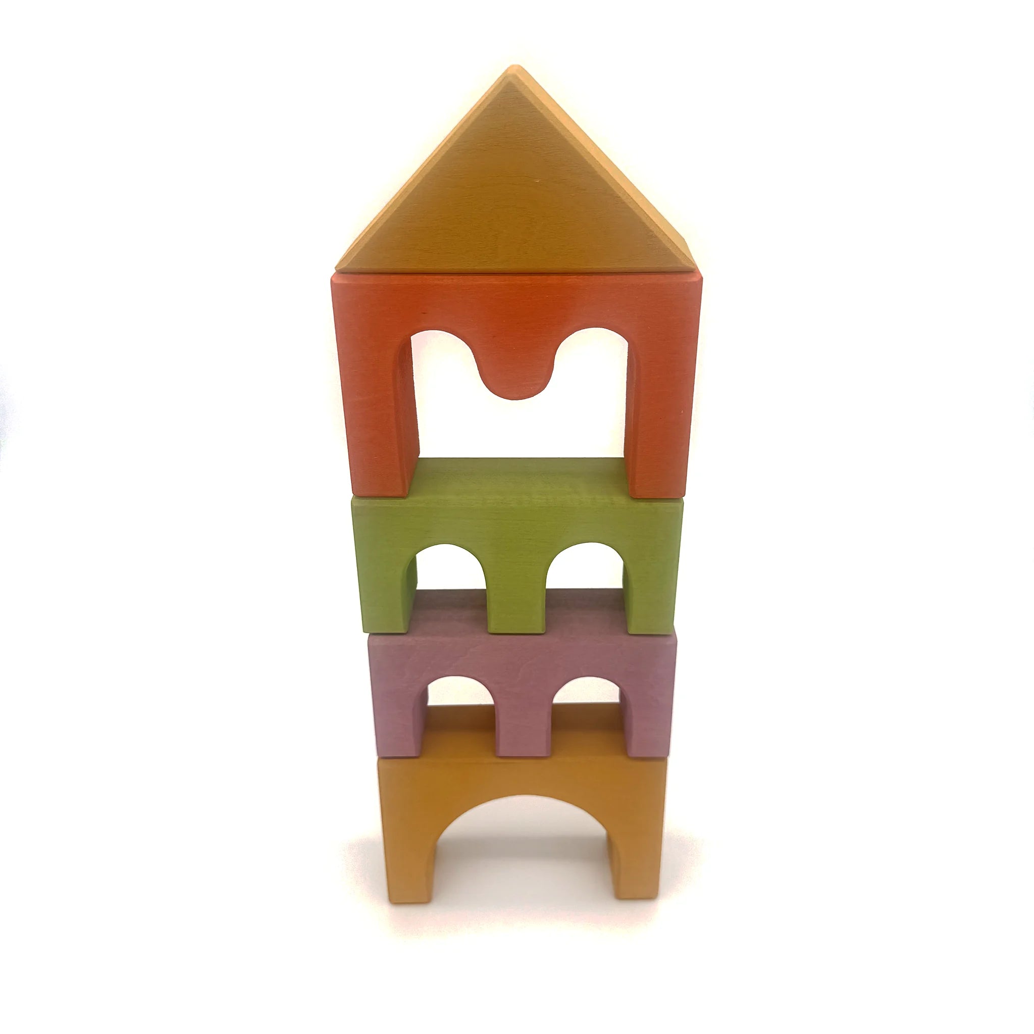 Wooden castle building blocks stacked into a tall tower