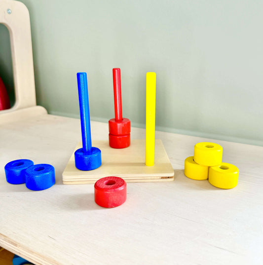 Montessori inspired wooden toy coloured dowels set promoting fine motor skills, hand-eye coordination, and eco-friendly open-ended play