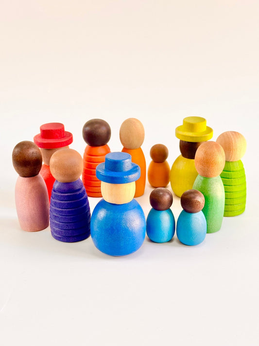 Colorful wooden peg dolls set of 12 in various shapes and sizes, celebrating diversity and imaginative play.