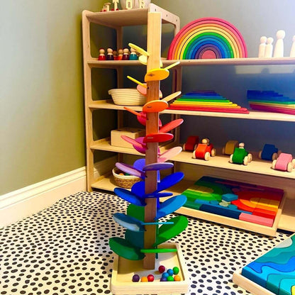 Rainbow Music Tree, a Montessori-inspired wooden toy with rainbow-coloured leaves, in a playroom with eco-friendly toys for open-ended play.