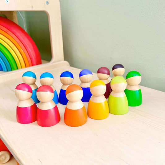 Wooden Rainbow Peg People set for Montessori inspired open-ended play, eco-friendly wooden toy promoting empathy and creativity.