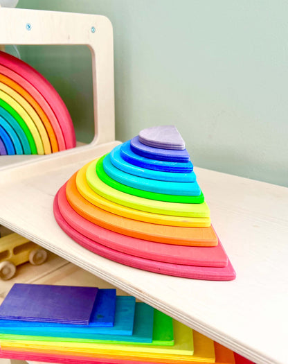 Eco-friendly wooden rainbow semi-circles for Montessori-inspired open-ended play, part of the rainbow stacker collection