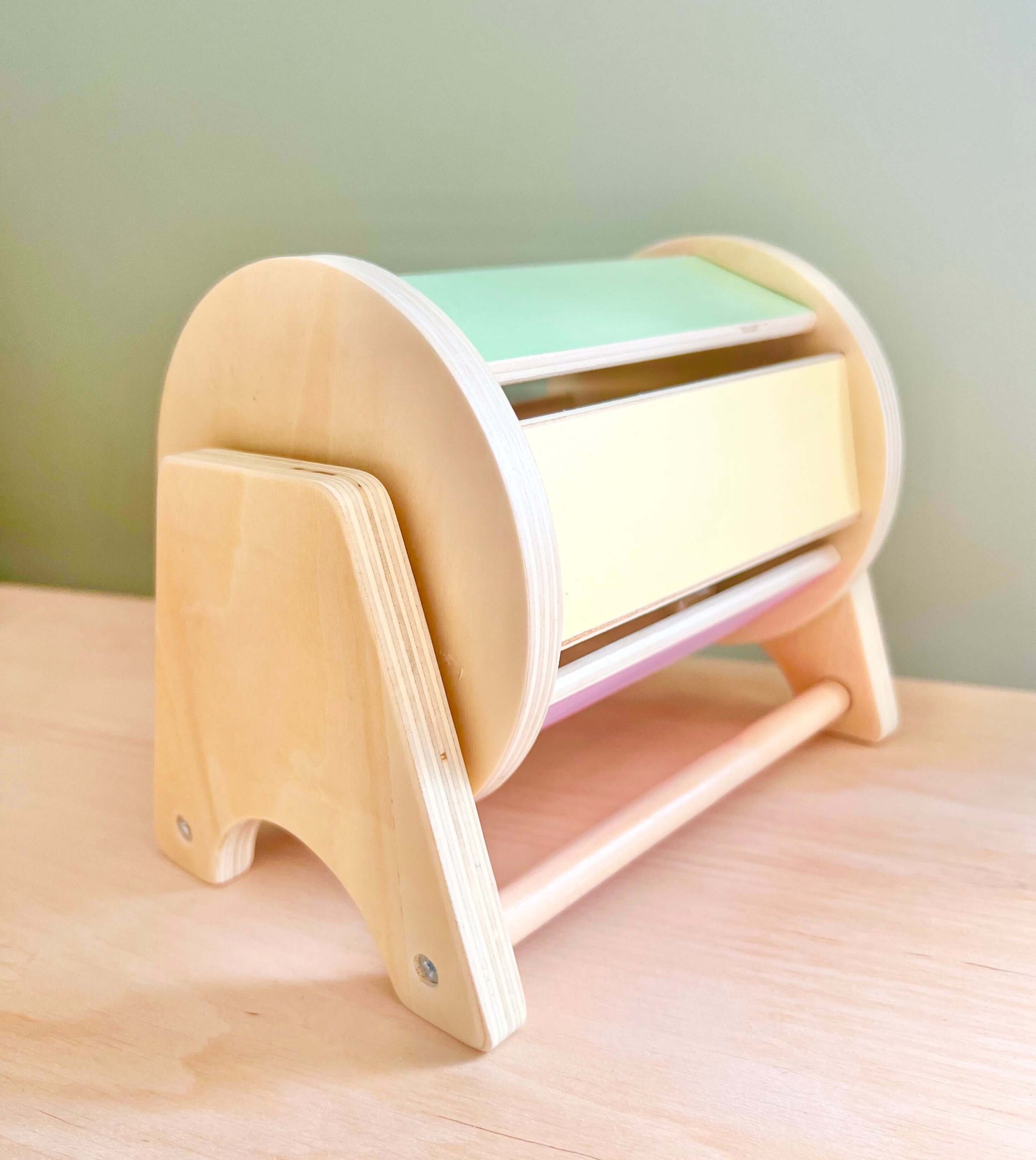 Montessori wooden spinning drum toy for toddlers, promoting eco-friendly, open-ended play and early sensory exploration